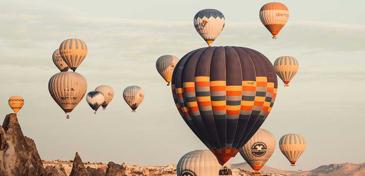 Hot air balloons on the sky during daytime in Cappadocia. infocappadocia.com
