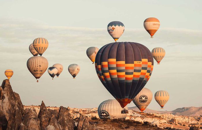 Hot air balloons on the sky during daytime in Cappadocia. infocappadocia.com