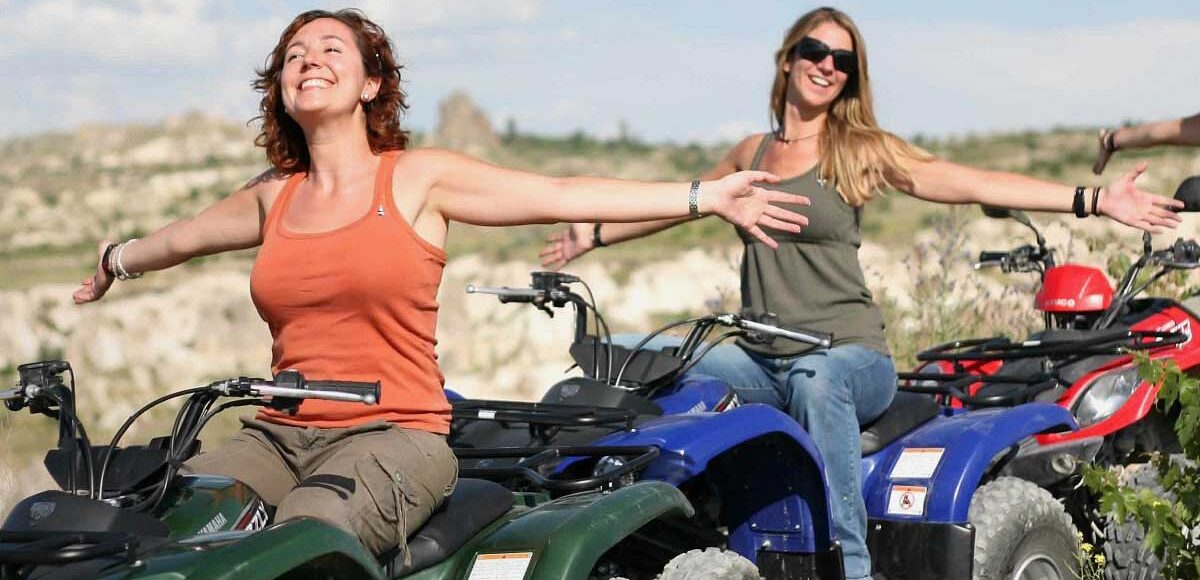 Adventure Riders Stopping for Photos on Cappadocia Hilltop Viewpoint