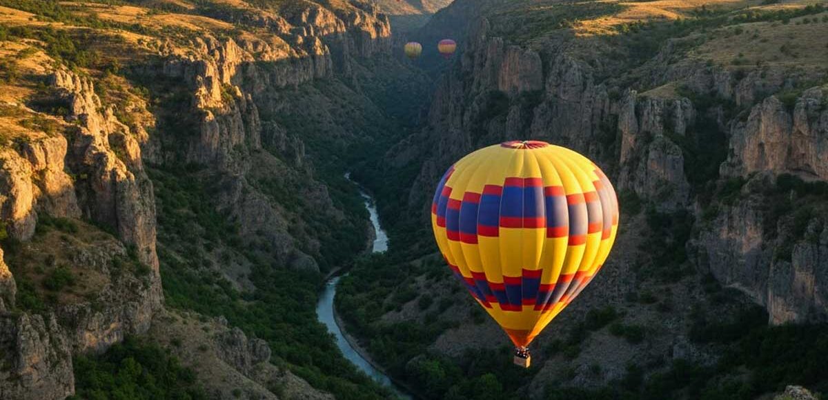 Ihlara Valley hot air balloon flight over green canyon at sunrise